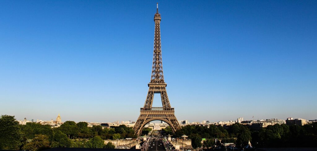 Stunning daylight shot capturing the Eiffel Tower with clear blue skies in Paris.
